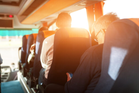 interior of bus with passengers rear view interior of bus with passengers rear view